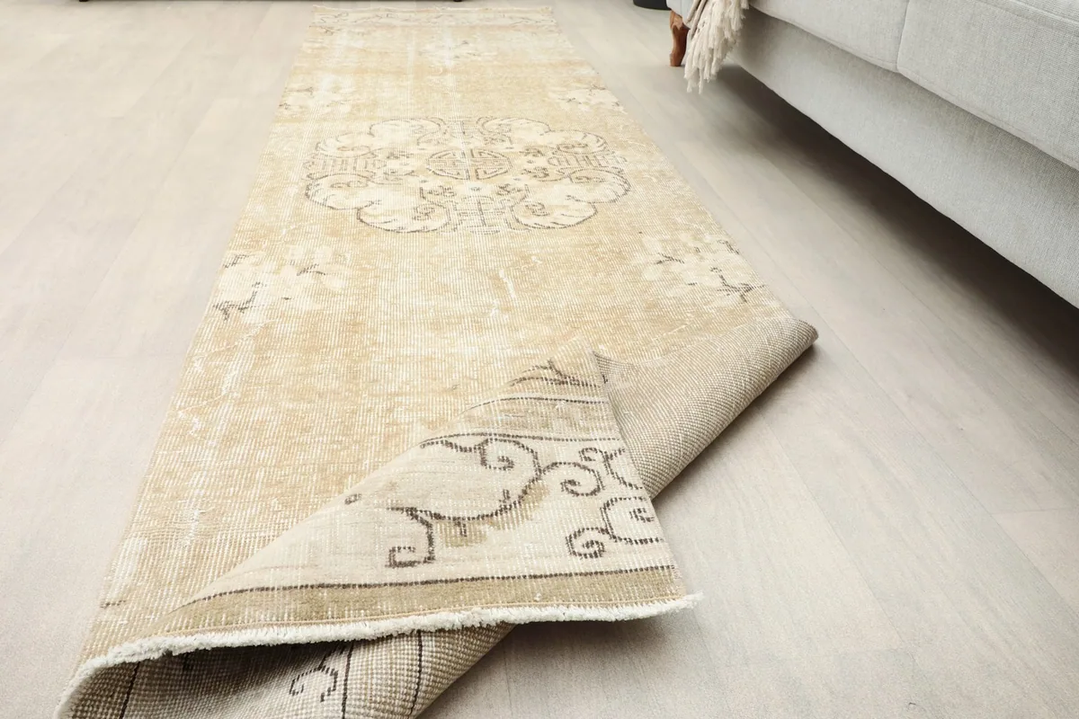 The runner rug partially folded, illustrating its flexibility and the overall pattern.