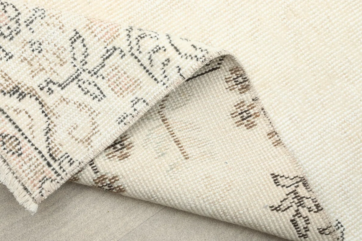 View of the reverse side of the hand-knotted wool pile on cotton foundation