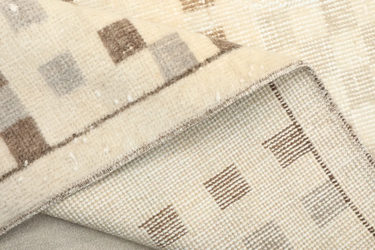 View of the back of the runner, showing the hand-knotted cotton foundation