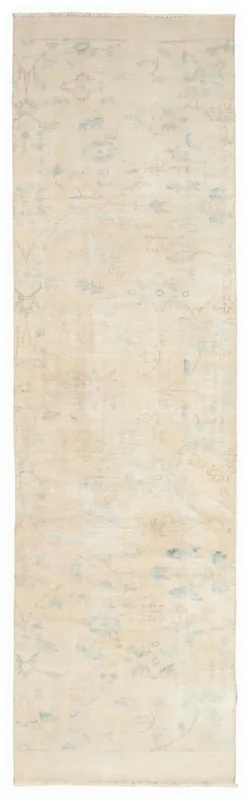 Full overhead view of the 2'11" x 10'6" ivory vintage Anatolian runner rug on a white background.