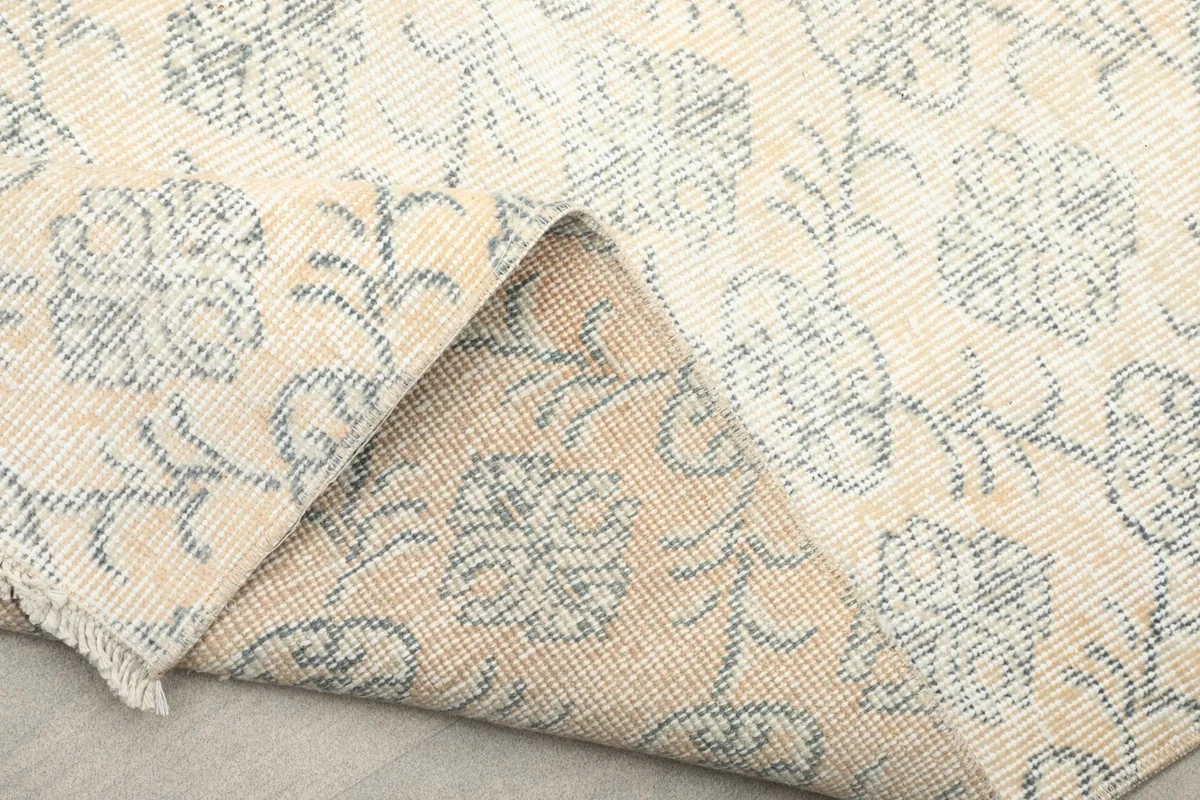 Another view of the rug folded, showcasing the reverse side's texture and the pile's density.