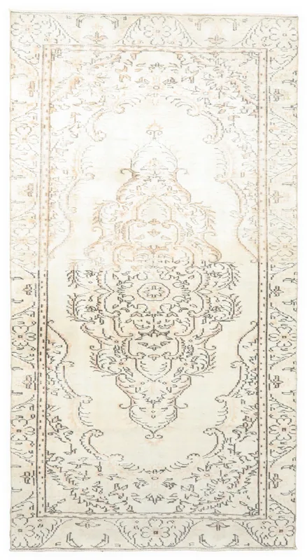 Full overhead view of the 5'0" x 9'5" ivory and charcoal vintage Anatolian area rug