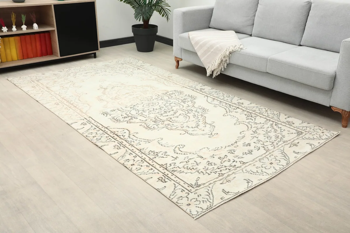 Angle view of the ivory rug in a room, highlighting its position relative to furniture