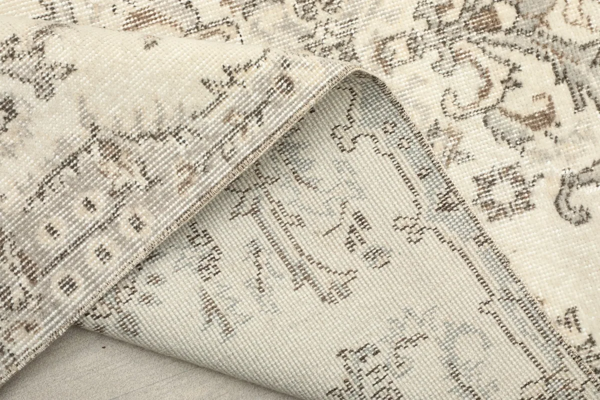 Another view of the rug's reverse side, highlighting the knotting and foundation