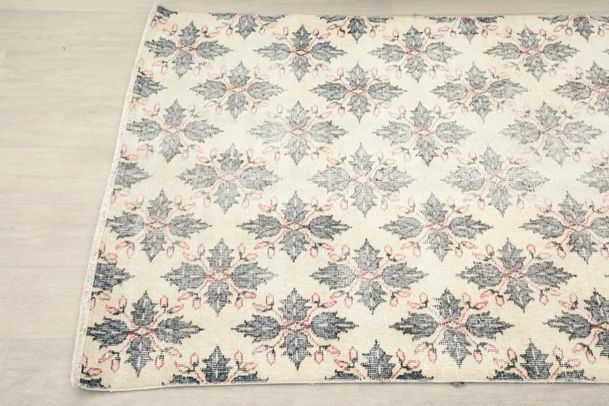 Another angled view of the vintage rug highlighting its overall design