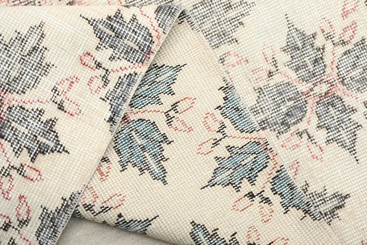 Close-up of the rug's folded edge, showing craftsmanship and material