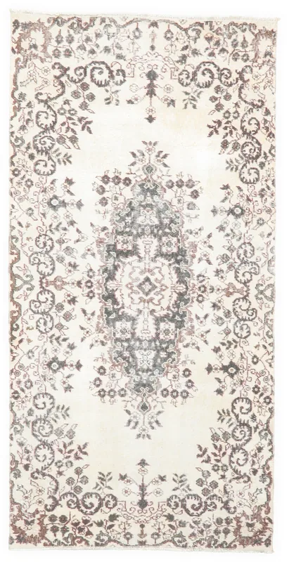 Full top view of the 3'11" x 7'10" ivory and charcoal vintage Anatolian rug
