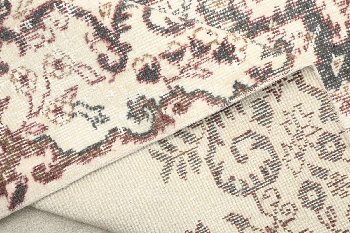 Close-up of the low wool pile and the tightly woven cotton foundation