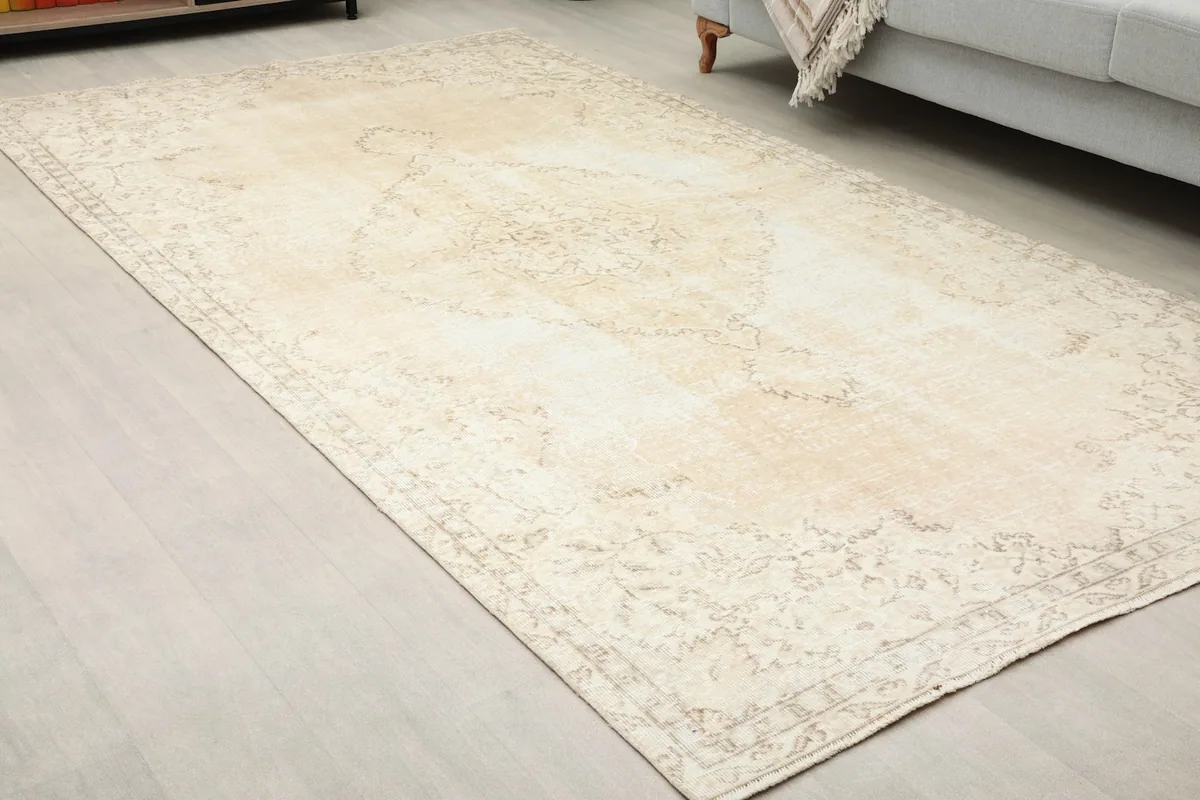 Angled perspective of the vintage wool rug highlighting its subtle patterns