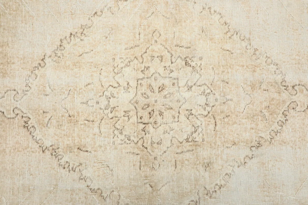 Close-up of the central medallion motif with its intricate geometric details
