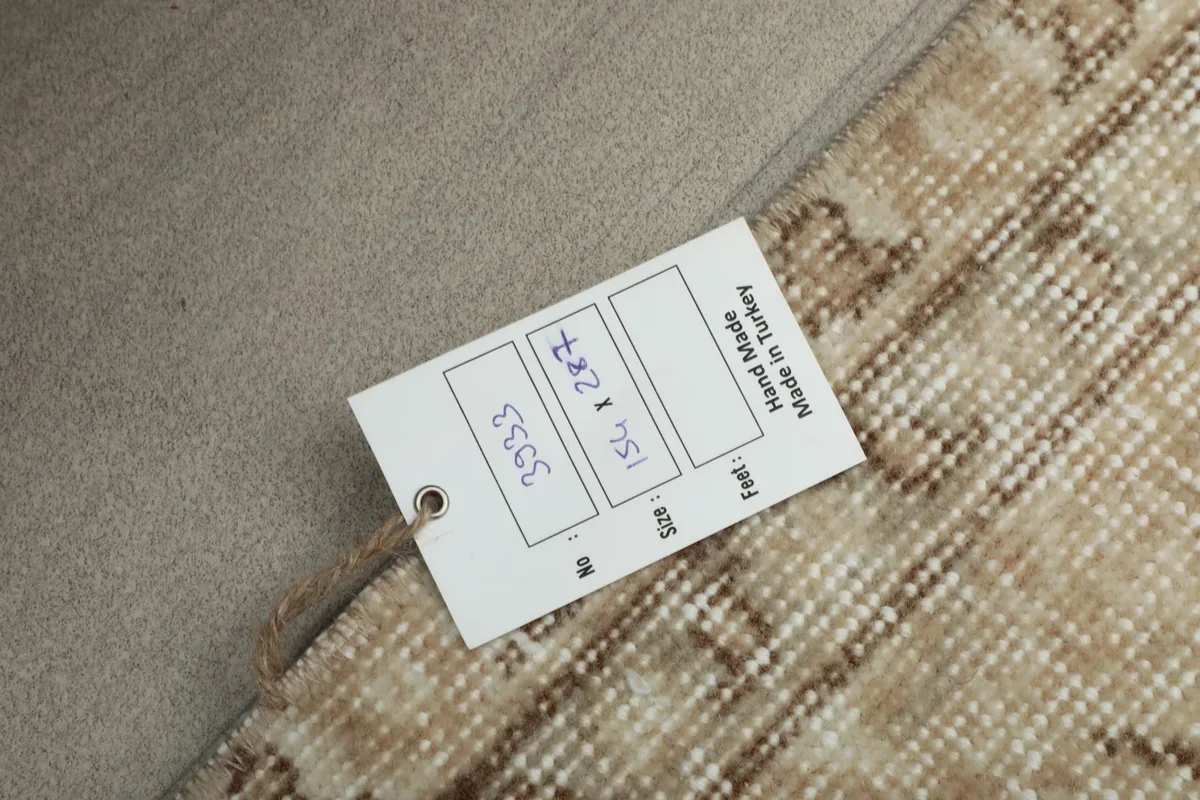 Product tag showing the rug's dimensions and origin as hand made in Turkey