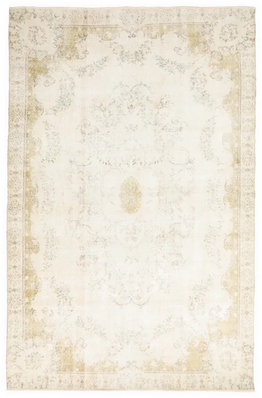 Full top view of the 6'6" x 10'1" vintage Anatolian rug with an ivory field and faded floral medallion design.