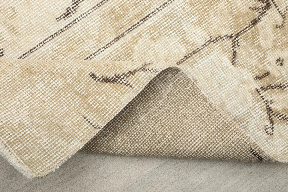 Another view of the rug's underside, revealing the sturdy cotton foundation.