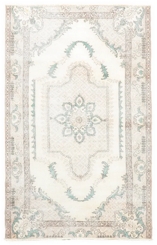 Full top view of the cream and green vintage Anatolian rug with central medallion.