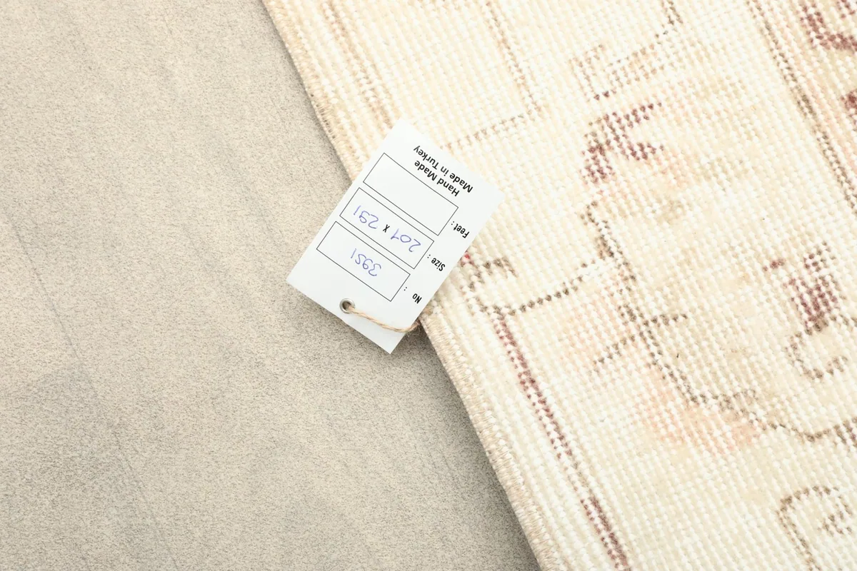 Back of the rug with a tag indicating origin from Turkey and size details.