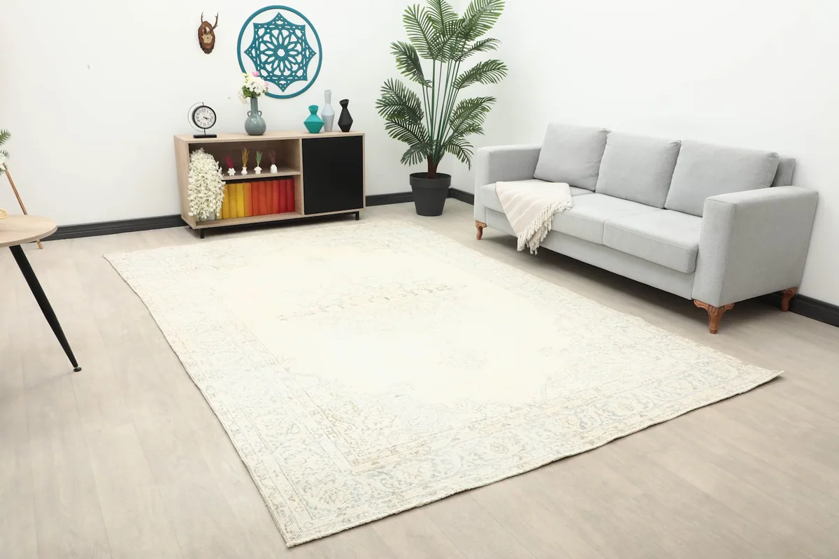 Wide view of the 7x11 vintage area rug in a modern living space with light walls and furniture