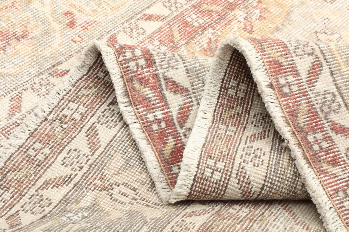 Folded section of the rug, illustrating its flexibility and thickness