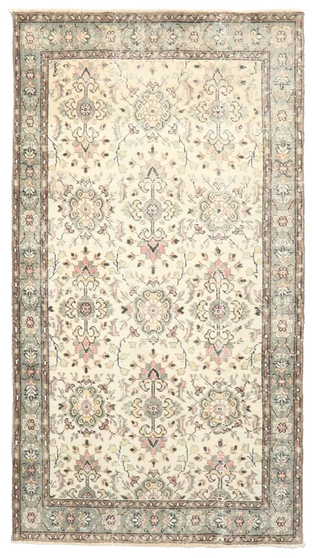 Full top view of the 4x7 ivory vintage Anatolian rug with rose and green floral patterns