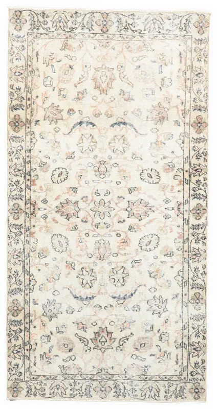 Full top view of the 3'6" x 6'9" ivory floral vintage Anatolian area rug on a white background