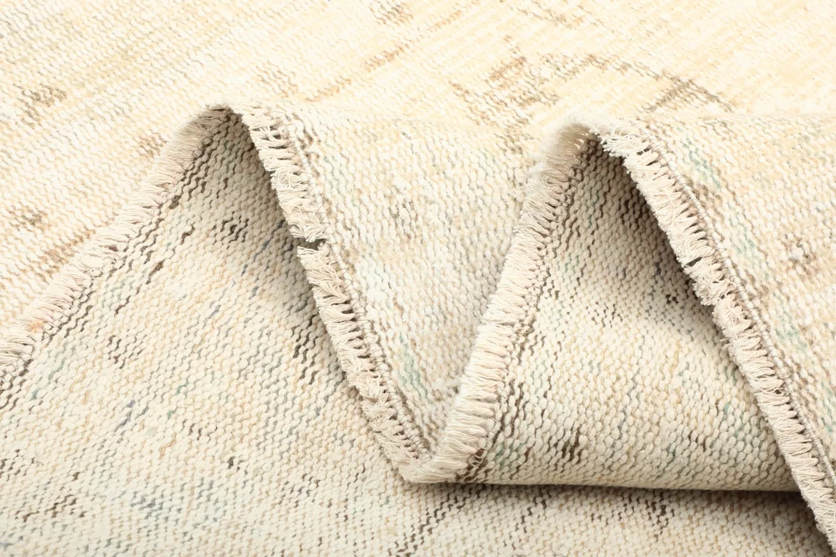 Another view of the folded rug, showing the flexibility and construction details