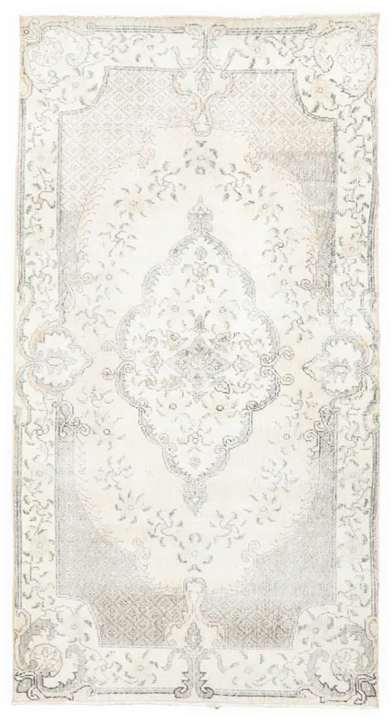 Full overhead view of the 4x7 ivory and gray vintage Anatolian rug on a white background.