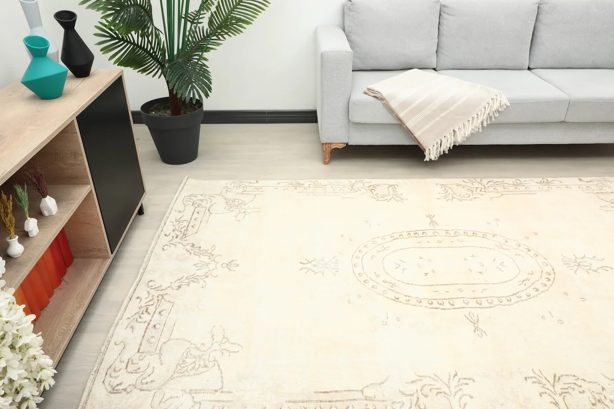 Angle view of the cream rug in a living room, highlighting its placement.