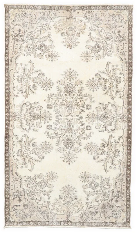 Full overhead view of the 3'11" x 7'0" ivory and brown floral Anatolian vintage rug on a white background.