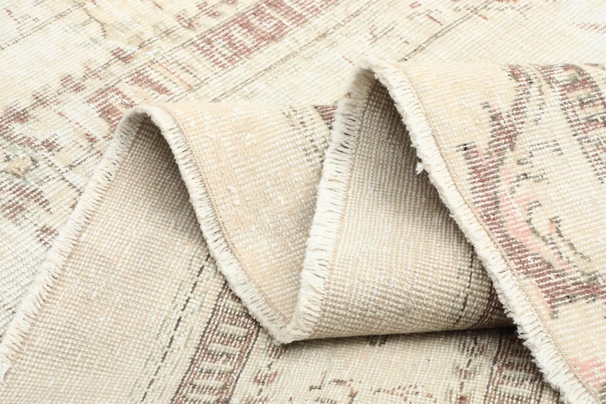 Rug folded to display its flexibility and the consistent weave from the back
