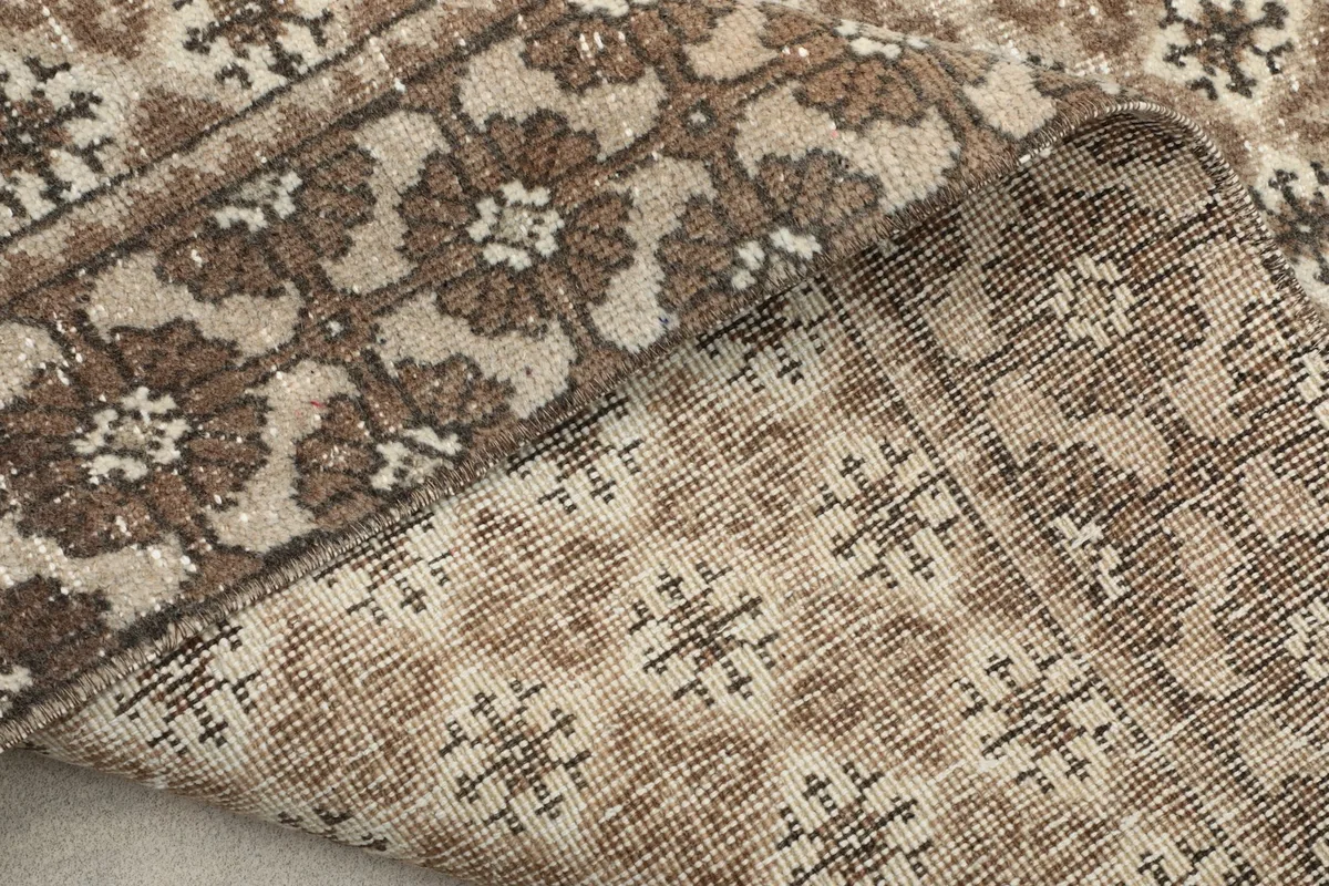 Detailed close-up of the rug's back, revealing the knot structure