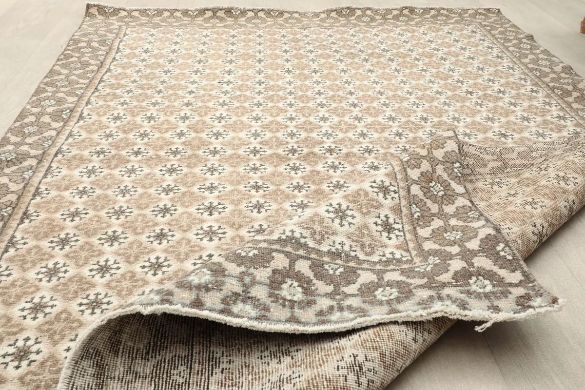 Folded corner of the rug, showing both front and back textures