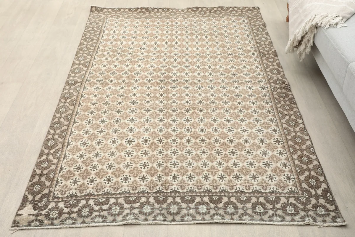 Overhead view of the small area rug on a light wood floor