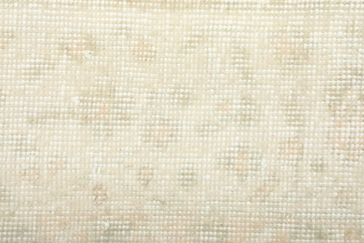 Close-up of the low wool pile, showing the texture and subtle color variations