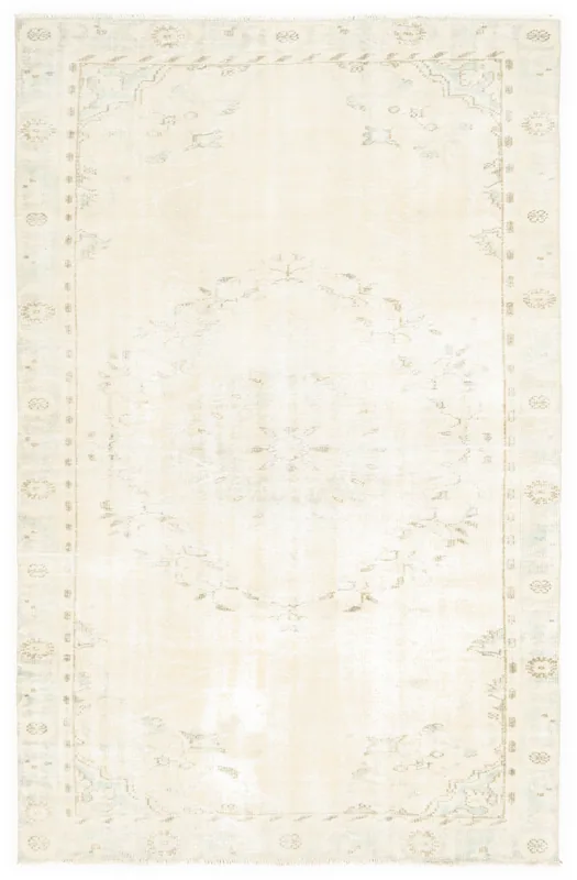 Full overhead view of the 6x9 ivory vintage Anatolian rug with a central medallion