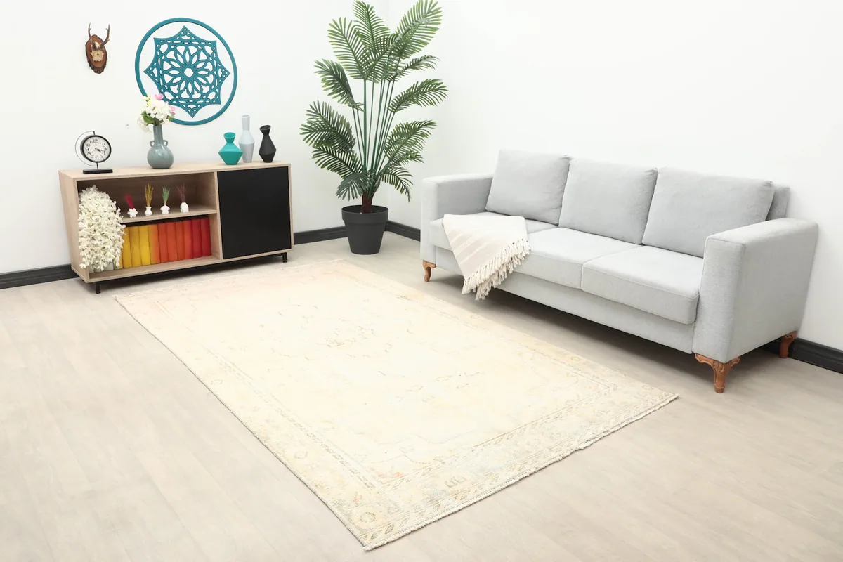Angle view of the ivory rug in a spacious room with minimalist furniture