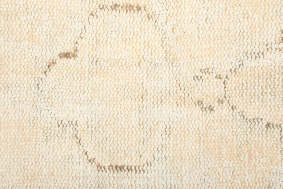Detailed view of the low wool pile and subtle color variations within the rug
