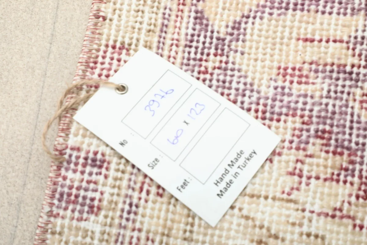 Tag showing the rug's item number and size, confirming it is hand made in Turkey.