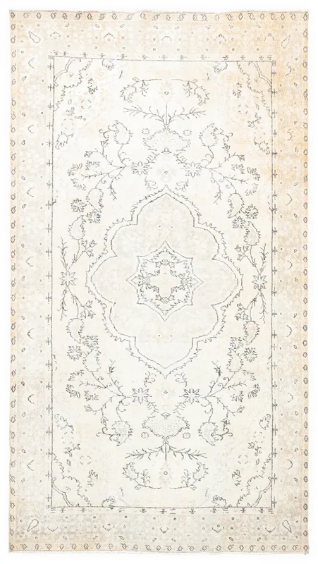 Full overhead view of a vintage cream and charcoal Anatolian wool rug with a central medallion.