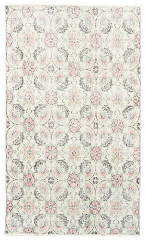 Full top view of the 3'10" x 6'6" ivory vintage Anatolian area rug with rose and blue floral lattice pattern