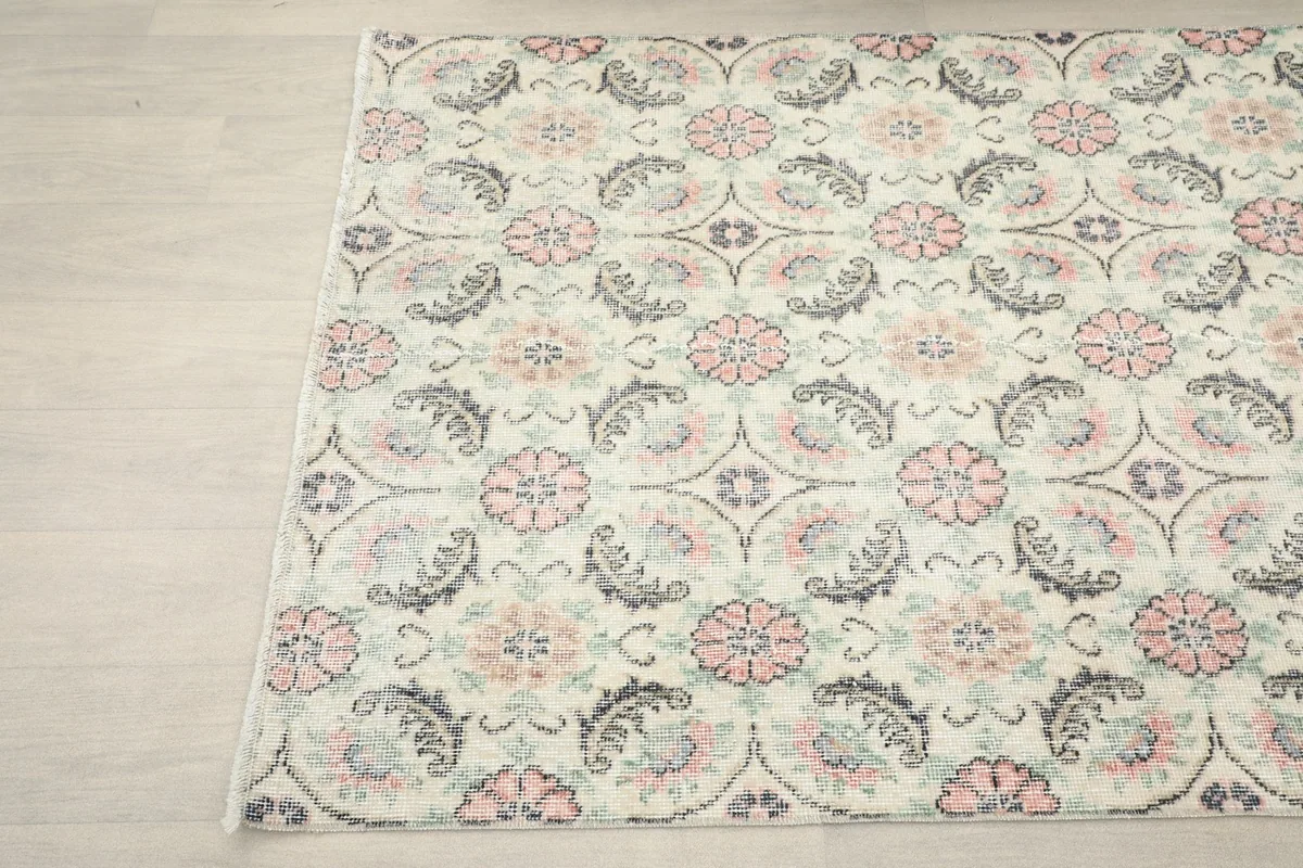 Another angle view highlighting the full pattern and colors of the hand-knotted wool rug