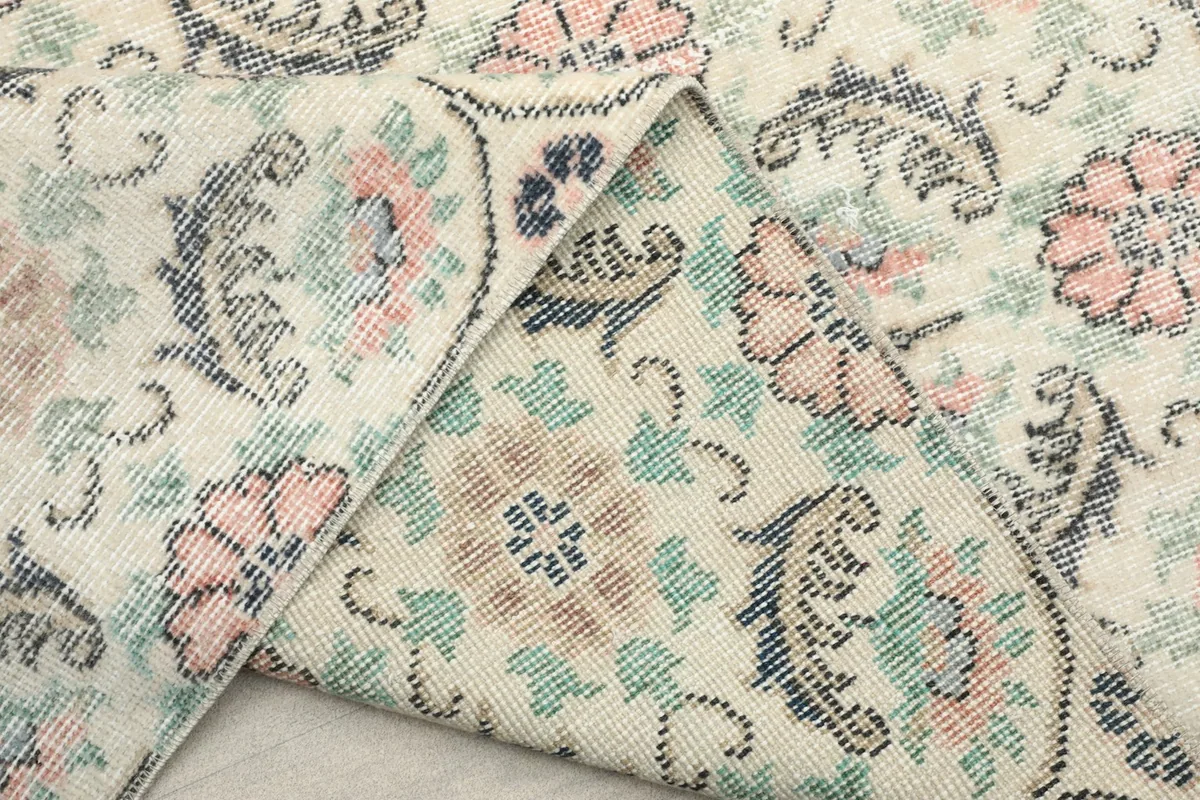 View of the rug's back and pile, demonstrating the hand-knotted construction and material