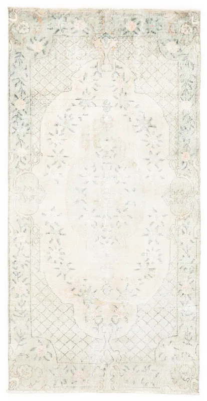 Full top view of the 4x7 ivory, green, and pink floral Anatolian vintage runner rug.