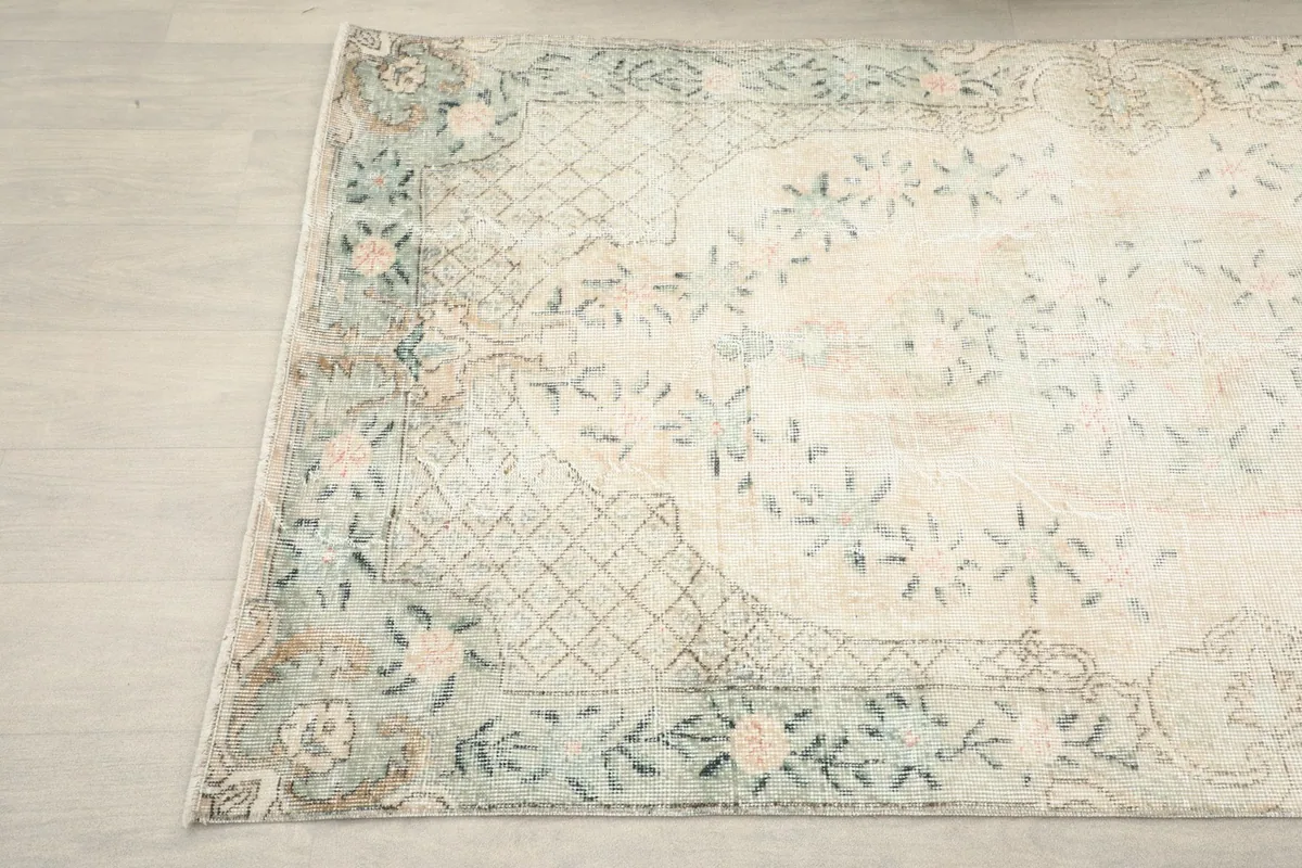 Another detailed view of the rug's pattern and border from a different angle.