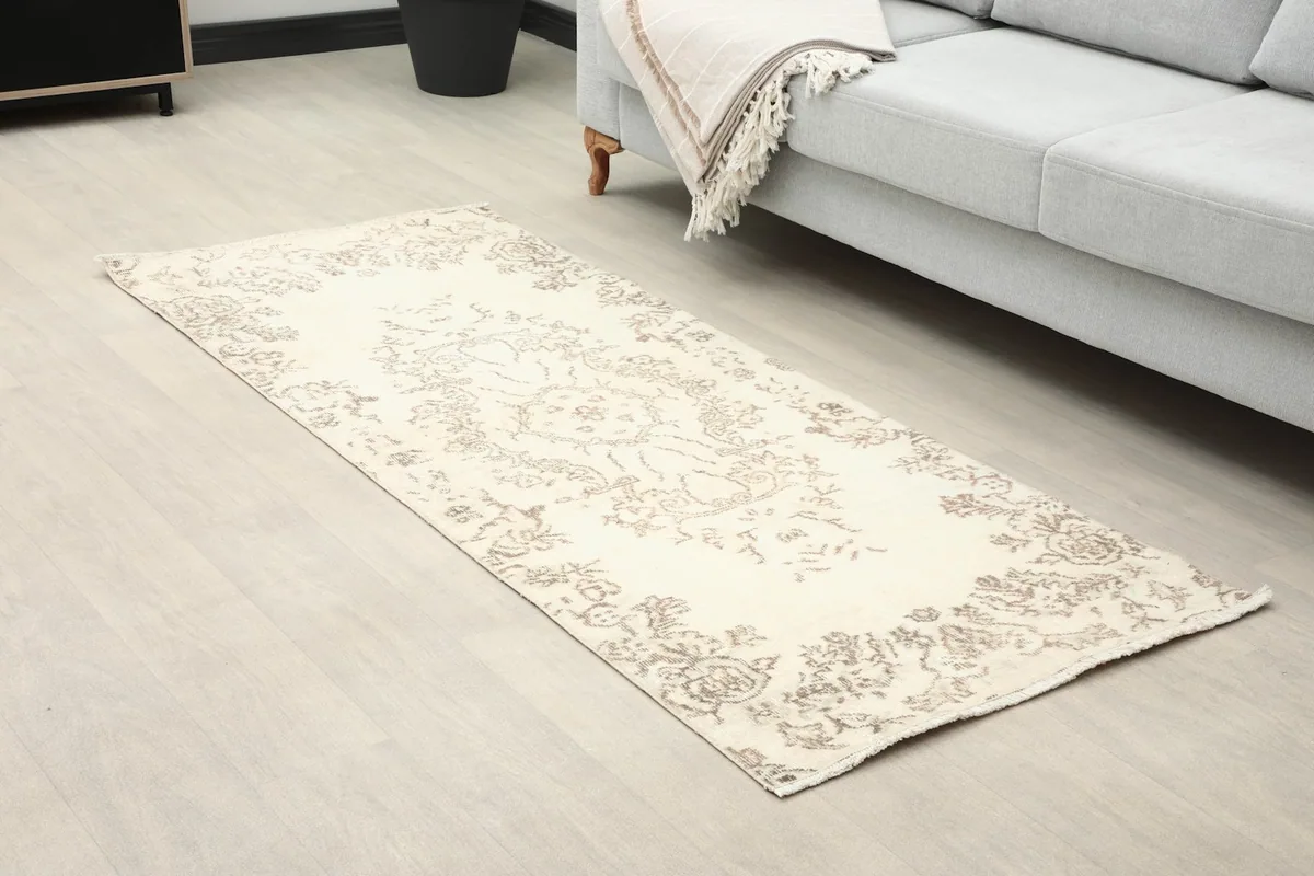 Angled view of the runner in a living room, highlighting its size and placement on the floor.
