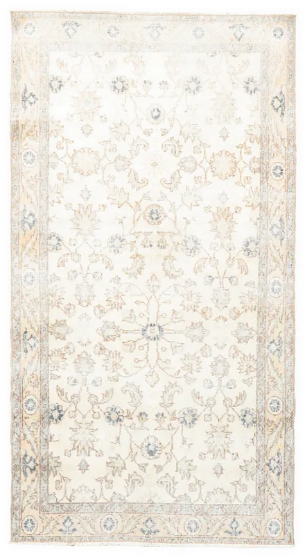 Full top view of the 3'7" x 6'8" ivory, blue, and tan vintage Anatolian rug on a white background.
