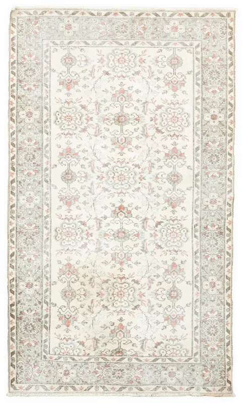Full top view of the 4'1" x 7'0" vintage Anatolian rug with ivory field and rose floral motifs