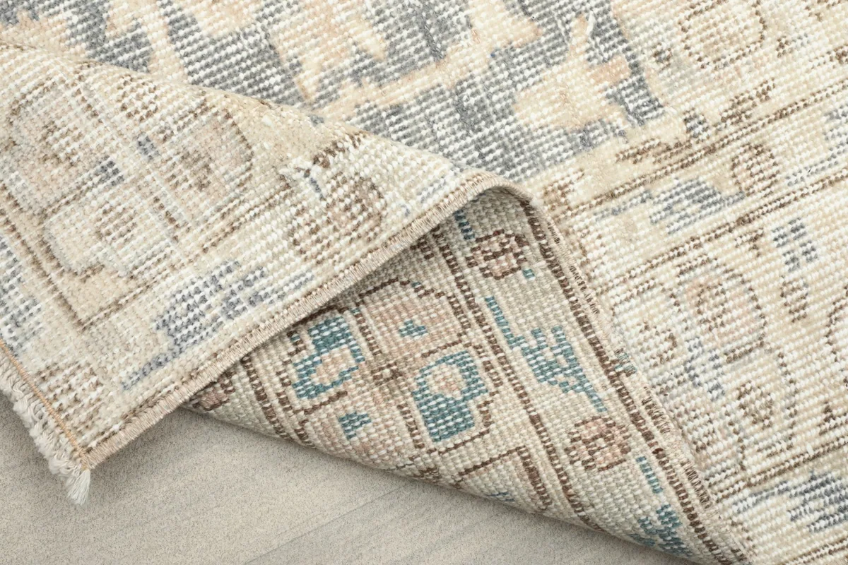 Another view of the folded rug, showcasing the craftsmanship and tight weave.