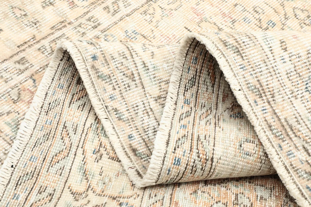 Folded section of the rug showing the back of the weave, demonstrating its authentic hand-knotted quality.