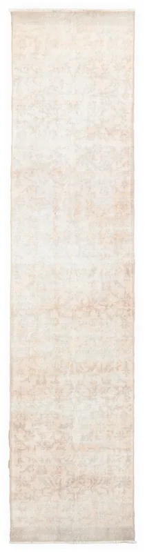 Full overhead view of the beige and cream vintage Anatolian runner rug on a white background.