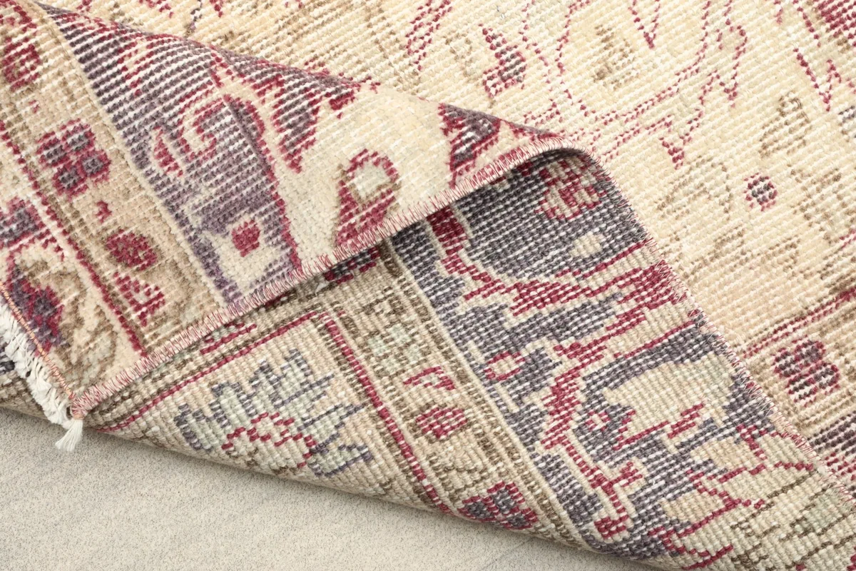 Another angle of the runner's reverse side, revealing the detailed knotting and craftsmanship of the vintage rug.