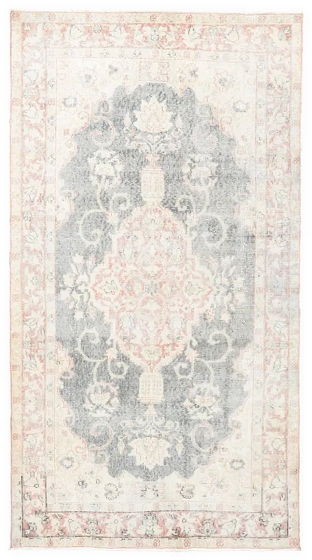 Full top view of the charcoal and rose medallion vintage Anatolian rug on a white background